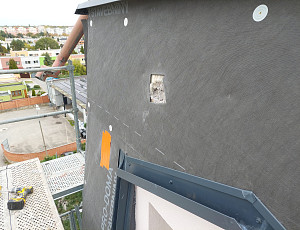 Zateplení bytového domu pomocí foukané izolace